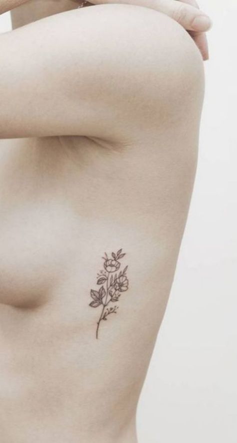 10 Of The Coolest Tattoo Designs You Should Totally Get - Society19 Flower Rib Tattoo, Flower Tattoo On Ribs, Flower Tattoo On Side, Sunflower Tattoo Shoulder, Tattoos For Women Flowers, Small Flower Tattoos, Best Tattoos For Women, Simple Tattoo Designs, Disney Tattoo