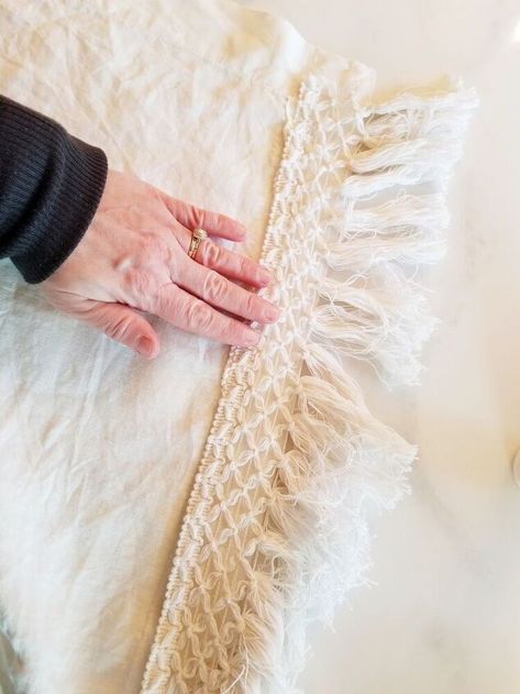 I found a linen tablecloth at a thrift store and used some clearance fringe to give it a fresh Boho look. I found a pretty cream colored linen table cloth at a thrift store recently. I knew it would be the perfect piece to upcycle. I had a bolt of fringe that I found in the clearance section at Hobby Lobby and knew this would dress up this tablecloth perfectly. After a good wash. I pressed the edges of the tablecloth to be sure there was a flat surface to attach the trim to. I… Tablecloth Diy, Diy Tablecloth, Linen Table Cloth, I Knew It, Fabric Glue, Table Cloths, Boho Look, Linen Tablecloth, Hobby Lobby