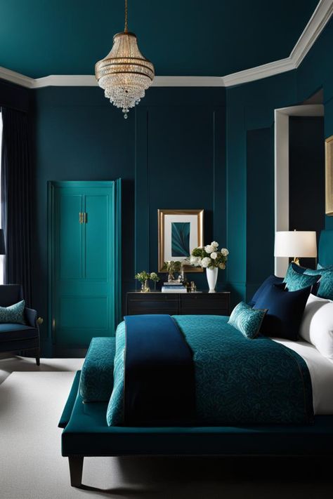 Envision a room in a dark teal, with a black wood bed frame and a velvet bench in navy blue at the foot. Light wood flooring and a cream area rug contrast the walls, with a gold-framed mirror adding sophistication. Teal Room Color Scheme, Blue Monochromatic Bedroom, Dark Teal Home Decor, Teal Headboard Bedroom, Deep Teal Bedroom, Colour Ideas For Bedroom, Navy And Teal Bedroom, Teal Bedroom Color Schemes, Bedroom Inspirations Teal