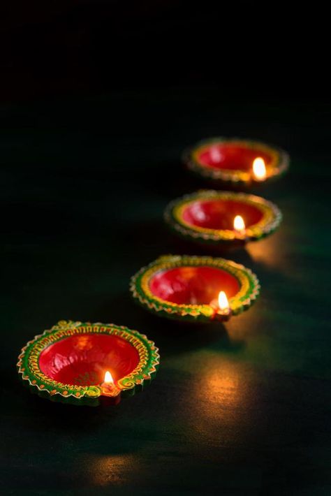 Diya lamps lit for Diwali celebration Diwali Lamp, Diwali Fireworks, Diwali Diyas, Hanuman Ji Wallpapers, Diya Lamp, Diwali Lights, Diwali Diya, Hanuman Ji, Diwali Wishes