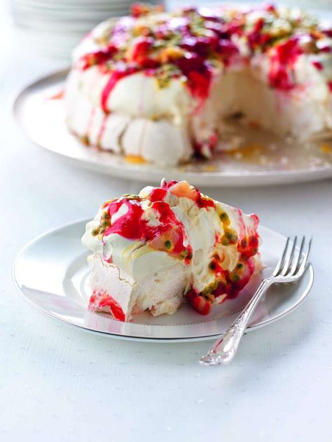 Prodigious Pavlova Recipe by Nigella Lawson | Stunning Xmas Dessert Nigella Lawson Christmas, Best Pavlova, Pavlova Recipes, Nigella Christmas, Nigella Lawson Recipes, Xmas Desserts, Pavlova Recipe, Raspberry Sauce, Mary Berry