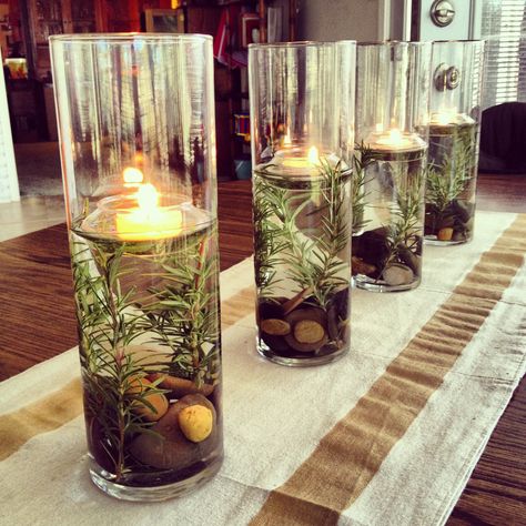 Festive Centerpiece - River rocks, Rosemary & Floating Tealights River Rock Wedding Centerpieces, River Rock Wedding Decor, River Party Decorations, River Rock Centerpiece, Masculine Birthday Party Centerpieces, Centerpieces For Male Party, Earth Centerpieces, Masculine Table Decor, River Themed Party