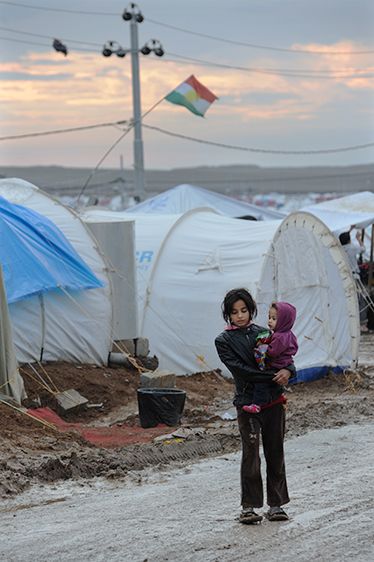 A Syrian girl holds a younger child in a refugee camp in northern Iraq. Some 2 million Syrian children are in need of assistance. I remember when Syria took in the Iraq refugees, now the tables are turned. When is this going to STOP!!! Bilderberg Group, Save Syria, Lode A Dio, Arab Girl, Syrian Children, Heart Aches, Isaac Newton, Refugee Camp, Poor Children