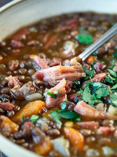 Ham and lentil soup is scrumptiously filling for those colder months. A hearty hambone soup packed with lentils, vegetables, and flavour. Easily made on the stove, in your pressure cooker, or slow cooker. Slow Cooker Ham And Lentil Soup, Ham Lentil Soup Crockpot, Lentil Soup Ham Bone, Ina Garten Lentil Soup, Lentil Soup With Ham Bone, Ham Bone Lentil Soup, Lentil And Ham Soup Recipe, Ham Lentil Soup, Hambone Soup