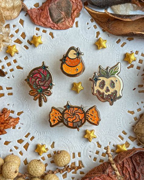 This set of colorful spooky candies, is perfect to fill tiny spaces on pin boards or to be applied to your bag, your coat or other accessories.  These mini candies will look delicious on everything and everywhere . The listing is for a set of 4 mini pins. The Pins feature: * Hard Enamel. * Gold plating. * One rubber clutch. * Glitter details.  * My logo on the back. * the pins range between 1 cm up to 2 cm. * A backing card is included in the purchase The full collection option includes:  * Six