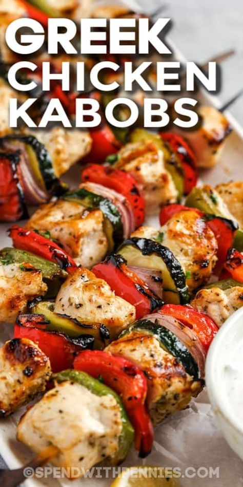 This recipe for Greek chicken kabobs makes a delicious meal with rice and yogurt tzatziki. Chucks of chicken are placed in a tangy Greek-style marinade made with garlic, lemon, oregano, and olive oil. Then thread them onto shish kabob skewers, alternating with red onion, colorful bell peppers, and zucchini. This dish is fresh, summery, low in calories, and packed with nutrition! #greekchickenkabobs #chickenkabobs #greek #recipe #spendwithpennies Greek Kebab, Rice And Yogurt, Marinated Chicken Kabobs, Meal With Rice, Greek Yogurt Marinated Chicken, Chicken Kabob Marinade, Greek Chicken Kebabs, Greek Chicken Skewers, Chicken Shish Kabobs