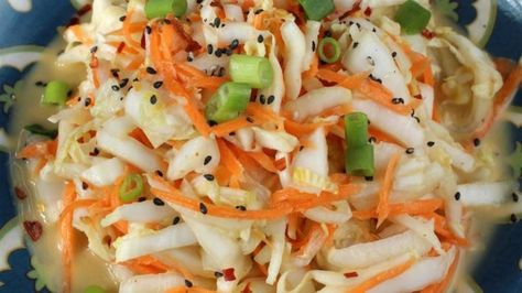 Cabbage and carrots get a quick brine, then a dressing of sesame, vinegar, cayenne, and sugar for great kimchi flavor without the wait. Kimchi Salad, Kimchi Slaw, Side Dishes For Ribs, Easy Kimchi, Korean Kitchen, Spicy Salad, 5 Ingredient Dinners, Vegetarian Cabbage, Cabbage Salad