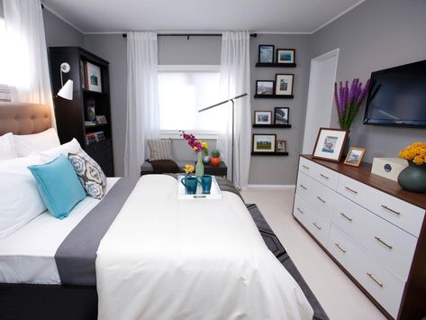 A bench by the window takes the place of a built-in window seat in this cool gray bedroom. A bookshelf with a light for reading and a TV in front of the bed make this space the perfect getaway. Built In Window Seat, Bedroom Decor For Women, Floating Shelves Bedroom, Contemporary Bedrooms, Gray Walls, Apartment Bedroom Decor, Bedroom Floor Plans, Grey Room, White Floors