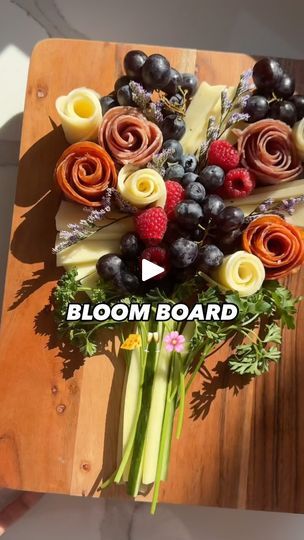 94K views · 8.3K reactions | DETAILS HERE ✨⬇️

A bloom board is exactly what you need to make as an appetizer for those sunny days ahead hosting people over!🌷🌸🧀 they bring that WOW factor!! 

What I used:

🧀 salami 
🧀 spicy salami
🧀 provolone cheese slices (for the cheese flowers) 
🧀 truffle cheese 
🧀 cucumber & parsley (for the stems)
🧀 grapes
🧀 raspberries
🧀 blueberries
🧀 flowers for garnish 

SAVE this to recreate for spring and Mother’s Day & follow @convinoboard for more ✅🌷🧀

•
•
#easyappetizers #cheese #appetizers #foodie #charcuterieboard #foodstyling #cheeseboard #grazingtable #charcuterie #springfood #entertainingathome #dinnerparty | Nicolle | Cheese, Wine, Easy Appetizers & Recipes | convinoboard · Original audio Cheese Flowers, Chacuterie Board, Cheese And Cracker Tray, Wine Appetizers, Truffle Cheese, Cheese Wine, Food Boards, Book Theme, Charcuterie Inspiration