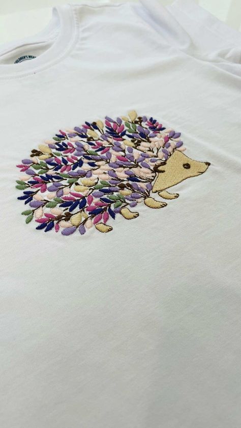 Adorning Your T-Shirt with a Delightful Hedgehog Embroidery Design Wearing a t-shirt is about comfort and expression, and what better way to express oneself than with a touch of art? Enter the hedgehog embroidery design - a subtle yet captivating design that's perfect for both adults and kids. Merging Nature's Charm with Everyday Fashion Hedgehogs, with their spiky appearance yet gentle nature, are a favorite among many. Translating this creature's essence into embroidery brings... Embroidery Hedgehog Simple, Embroidered Hedgehog, Hedgehog Embroidery, Personalised Embroidery, Personalized Embroidery, T Shirt Style, Free Embroidery Designs, Hedgehogs, Business Resources