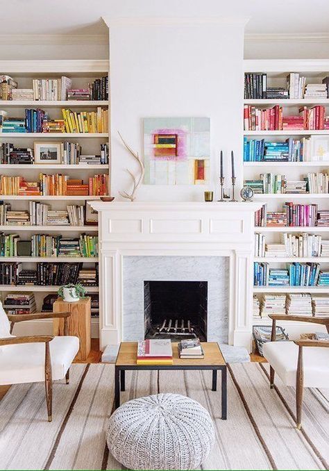 These stylish bookshelves and cozy fireplace make a home library to die for. Home Library With Fireplace, Library With Fireplace, Library Fireplace, Beautiful Bookshelf, Art Rugs, Bookshelf Styling, Home Libraries, Fireplace Mantle, Style At Home