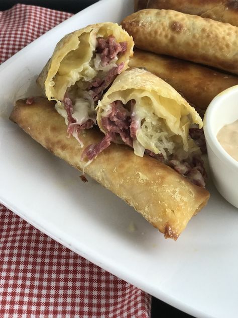 Air Fryer Reuben Egg Rolls recipe for St. Patrick's Day is filled with Corned Beef, Melted Swiss Cheese, Sauerkraut and dipped in 1000 Island dressing. Egg Rolls In Air Fryer, Reuben Egg Rolls, Rolls In Air Fryer, 1000 Island, Egg Rolls Recipe, Air Fryer Oven Recipes, Egg Roll Recipes, Air Fry Recipes, Delicious Appetizer Recipes