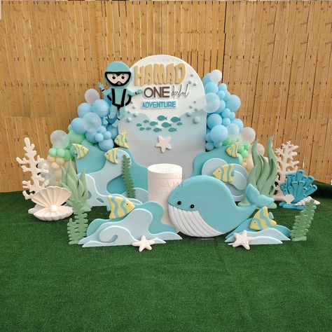 Beneath the surface lies hidden paradise Under The Sea Theme Birthday For More Details, Contact Here 👇 WhatsApp : +974 77 00 11 69 Call : +974 77 00 11 69 #undertheSea #undertheseaparty #undertheseatheme #undertheseathemedparty #undertheseastyrobackdrop #undertheseabackdrop #kidsparty #kidspartyideas #kidseventplanner #kidspartydoha #birthdayparty #birthdaypartydecor #partyqatar #balloondecorations #najatevents #najateventsplanner Sea Theme Birthday, Under The Sea Decor, Bday Party Kids, Baby Birthday Decorations, Baby Birthday Themes, Backdrop Birthday, Birthday Themes For Boys, Under The Sea Theme, Sea Birthday