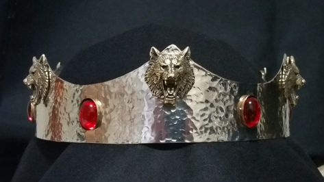 Made by Baron Randwulf -  20 ga. stainless steel coronet that has been peened. It has red pearl Cabochon's set in brass bezels and brass cast wolf heads Wolf Crown, Medieval Crown, Aegon Targaryen, Fantasy Kingdom, Cersei And Jaime, Robb Stark, Helmet Hat, Red Pearl, Cersei Lannister