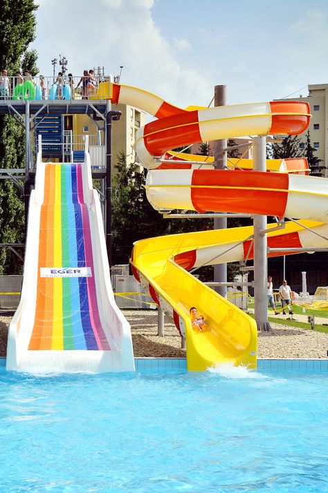 Two bright slides at the Thermal Spa of Eger. As you can see the wide water slide also has a logo printed on it. This is a nice customisation option that we can recommend on Wide Slides.  #waterslides #sunny #summer Big Water Slides, Water Park Rides, Indoor Pool House, Swimming World, Pool Party Kids, Thermal Spa, Carnival Rides, Water Parks, Fun Places To Go