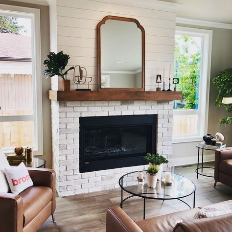 Shiplap fireplace, wood mantle, white brick surround make for a gorgeous living room focal point Bromik Design + Build Old Brick Fireplace, Brick And Shiplap, White Wash Brick Fireplace, Modern Farmhouse Fireplace, Wood Mantle Fireplace, Brick Wall Decor, White Brick Fireplace, Painted Brick Fireplace, Wood Mantle