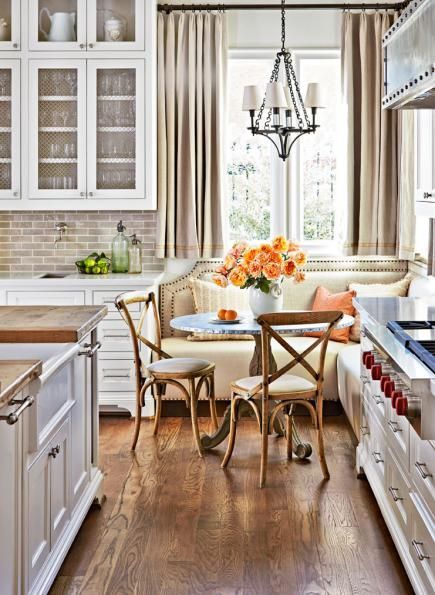 Kitchen banquette: If space is tight, opt for a pedestal table that leaves plenty of leg room. More ideas for banquettes: http://www.midwestliving.com/homes/decorating-ideas/6-ideas-for-kitchen-banquettes/ Kitchen Banquettes, Antique White Kitchen Cabinets, Antique White Kitchen, Farmhouse Kitchen Backsplash, Kitchen Banquette, Kitchen Seating, Kitchen Corner, French Country Kitchen, Kitchen Nook