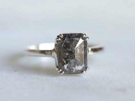 2 carat diamond ring, Grey diamond ring, Salt and pepper diamond, Emerald cut, Rose cut diamond ring, Diamond engagement ring, bezel settingAvailable in 9k/14k/18k yellow, rose or white gold. Same design can be made also with other custom gemstones per request. Product details:- approx. 2 carat diamond (1.8 to 2.2). We will show you the stone before using it!- 1.5 mm band Ring size - US 3 to US 9 (for smaller or larger ring size, please contact)Please select your size at the drop down menu. Serv Smokey Diamond Engagement Ring, Gray Engagement Ring, Salt And Pepper Ring, 2 Carat Diamond Ring, Diamond Ring Solitaire, Salt And Pepper Diamond Ring, Rose Cut Diamond Ring, Grey Diamond Ring, Raw Diamond Rings