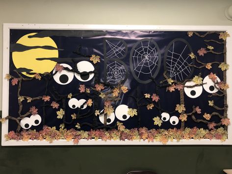 For our October bulletin board I went with a spooky forest to say, ‘Look out - fall is here!’  I love the mix of the fall leaves with eerie trees and lurking eyes.  Happy Halloween! #bulletinboards #october #pta Halloween Bulletin Boards For High School, October Middle School Bulletin Boards, Bulliten Board Ideas Fall, October Bulletin Boards Elementary, Halloween School Bulletin Board Ideas, Halloween Bulletin Board Ideas For Work, October School Bulletin Boards, Witch Bulletin Board, Halloween And Fall Bulletin Boards