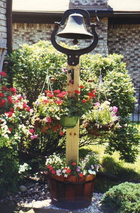 Vintage Farm Bell. In 1858, the C.S. Bell family cast their first farm bells, school bells and church bells in Hillsboro, Ohio, and started an American tradition. Dinner Bell Post, Front Porch Landscape, Cast Iron Bell, House Garden Landscape, Bell Gardens, Antique Bell, Driveway Landscaping, Dinner Bell, Magic Garden