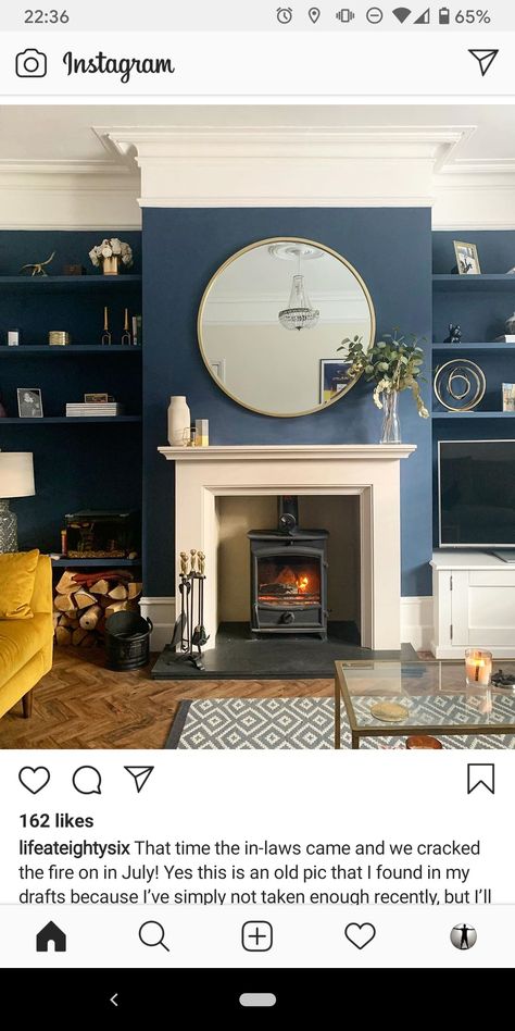 Blue Living Room Panelling, Blue Wall White Fireplace, Blue Sitting Room Ideas, Dark Blue Feature Wall Living Room, Hague Blue Living Room, Stone Hearths, 1930s Living Room, Dark Blue Rooms, Alcove Ideas Living Room