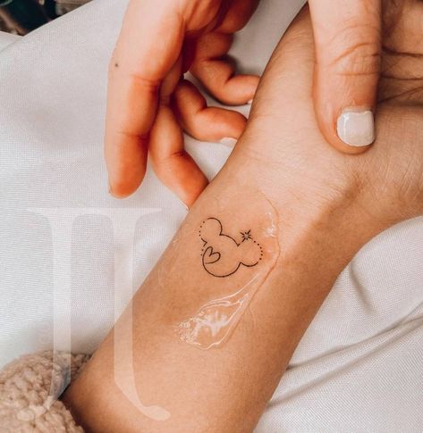 Disney Tattoos Wrist, Ankle Tattoo Disney, Discrete Disney Tattoos, Mini Mickey Tattoo, Mickey Mouse Tattoo Minimalist, Small Disneyland Tattoos, Feminine Disney Tattoo, Disney Tiny Tattoo Ideas, Minnie Mouse Wrist Tattoo