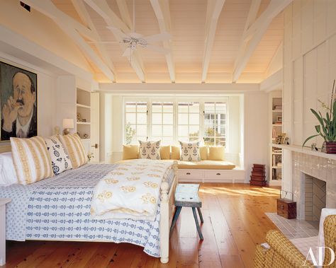 Howard J. Backen Revamps an Airy Farmhouse in Napa Valley Photos | Architectural Digest - Bare floors and quilted fabrics give the bedroom a casual feel. Bookshelf Ceiling, Beam Bedroom, Tiles Fireplace, Reading Bench, Coral Bedroom, Modern Farmhouse Style Bedroom, Ceiling Window, Beam Ceiling, Farmhouse Architecture