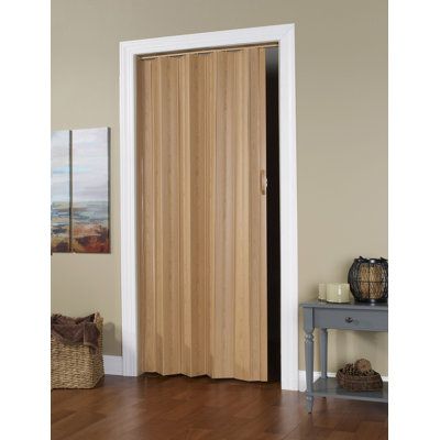 The homestyle accordion door offers value and durability. A cost-effective solution for your storage and privacy needs. Size: 49" x 95", Finish: Oak | Accordion Door - LTL Home Products Flush PVC / Vinyl Homestyle Accordion Door PVC / Vinyl in Brown, Size 49" x 95" | Wayfair Modern Accordion Closet Doors, Wood Accordion Doors, Accordian Closet Doors Ideas, Door Options For Small Spaces, Temporary Doors For Renters, Acordian Doors Modern, Basement Door Ideas Interior, Door Alternatives Diy, Accordion Closet Doors