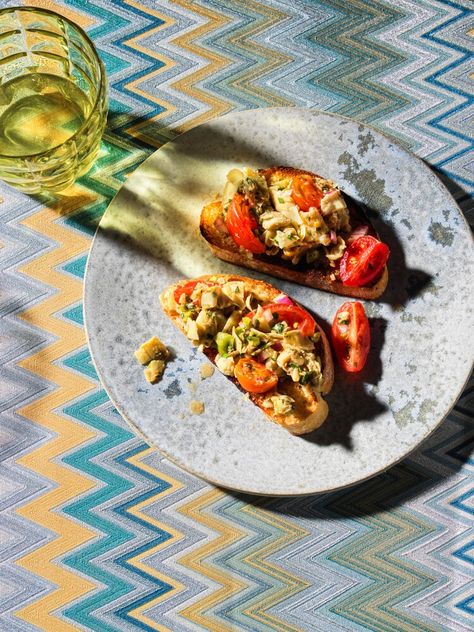 Artichoke Bruschetta with Capers and Cherry Tomatoes — Saveur Bbq Chicken Cobb Salad, Artichoke Bruschetta, American Appetizers, Strawberry Soup, Capers Recipe, Greens Restaurant, Bruschetta Recipe, How To Make Pesto, Bread Appetizers