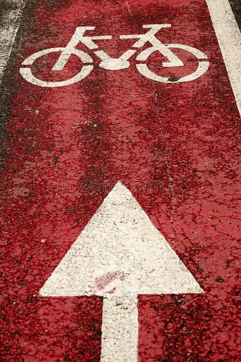 Bike path with a picture and an arrow on red asphalt stock photography Bike Path, Stock Photography, Photo Image, Stock Photos, Bike, Red, Photography