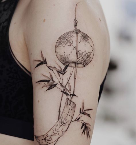 Norigae Tattoo Black, Delicate Japanese Tattoo, Wind Chime Tattoo Ideas, Japanese Windchime Tattoo, Fine Line Chinese Tattoo, Japanese Wind Chimes Tattoo, Asian Inspired Tattoos For Women, Japanese Ornament Tattoo, Feminine Japanese Tattoos