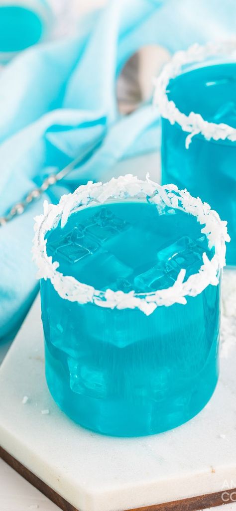 With vibrant blue colors and tropical vibes, this ocean water cocktail is a crowd-pleaser in both the looks and taste department. #amandascookin #cocktails #cocktailrecipes Ideas For Color Party, Ocean Water Cocktail, Raspberry And White Chocolate Cupcakes, Blue Party Foods, Summer Mixed Drinks, White Chocolate Cupcakes, Healthy Nutrition Plan, Blue Drinks, Blue Cocktails