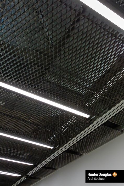 Stretch Metal Ceiling. Our focus on quality ensures the highest standard of production processes, material, machinery and finished product. The superior durability of Hunter Douglas products translates into lower costs during the life cycle of the product. #architecture #architect #ceiling #hunterdouglas Stretch Metal Ceiling, Lower Ceiling Ideas, Industrial Ceiling Design, Metal Ceiling Ideas, Metal Mesh Ceiling, Garage Interior Design, Mesh Ceiling, New Yorker Loft, Decorative Ceiling Panels