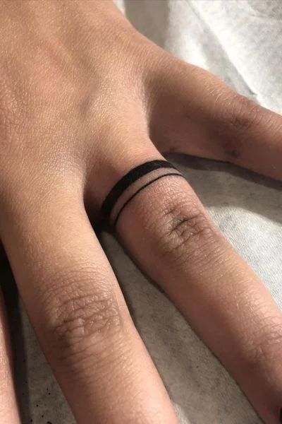 30+ Wedding Ring Tattoo Designs for Eternal Love - Tweakbee Wedding Finger Tattoo Ideas, Finger Tattoo For Man, Flame Ring Tattoo, Male Ring Finger Tattoo, Ring Tattoo Designs Men, Mens Tattoo Wedding Band, Couple Wedding Tattoos, Men’s Wedding Band Tattoos, Male Ring Tattoo