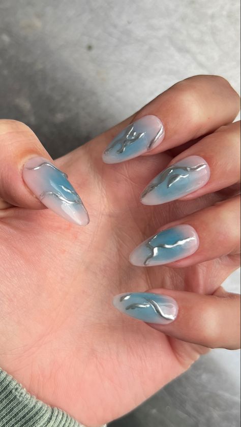 Light pink base with blue aura middle and silver 3D design over too Light Blue Nail Inspo Short, Blue Nails With Silver Design, Light Aura Nails, Light Blue Silver Nails, Silver And Light Blue Nails, Light Blue And Silver Nail Designs, Light Blue Aura Nails, Blue And Silver Nails Acrylic, Light Blue And Silver Nails