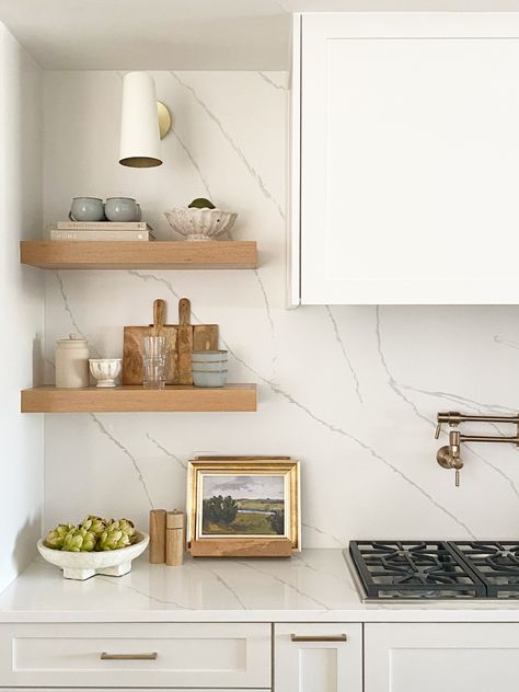 Stone Backsplash Ideas, Kitchen Shelfie, Layering Decor, White Stone Backsplash, Laundry Room Addition, White Marble Backsplash, Kitchen Niche, Wood Shelves Kitchen, Gold Pulls