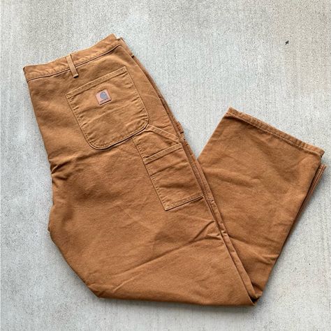 Here Is A Pair Of Carhartt Pants That Are Perfect For Workwear And Casual Wear. With A Solid Pattern, Brown Color And A Relaxed Fit, These Pants Are Made From Cotton And Flannel Fabrics, Making Them Suitable For The Winter, Fall, And Spring Seasons. The Pants Feature A Flat Front, Zip And Button Closure, And Have Accents Like A Button, Zipper, And Logo. These Carpenter-Style Pants Have A Straight Leg And A 32-Inch Inseam. In Addition, The Carhartt Pants Come With Lined Features To Provide Extra Carpenter Pants Outfit, Flannel Fabrics, Canvas Work Pants, Carhartt Flannel, Mens Rugged, Cargo Work Pants, Outfit References, Pants Outfit Men, Mens Work Pants