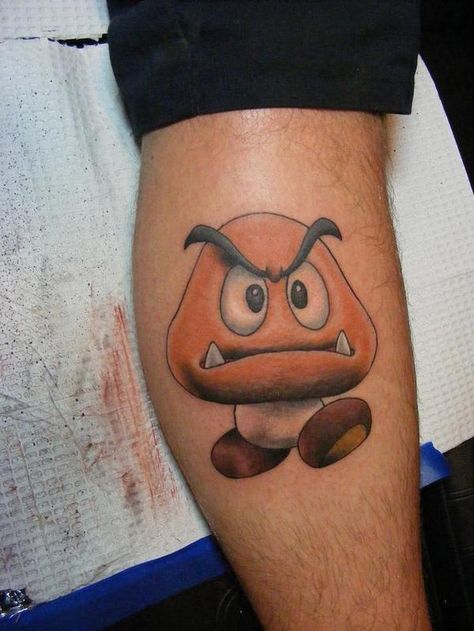 Goomba! Goomba Tattoo, Mario Goomba, Future Drawing, Game Tattoo, Mario Tattoo, Abstract Tattoo Ideas, Pisces Tattoos, Trending Tattoo, Gaming Tattoo