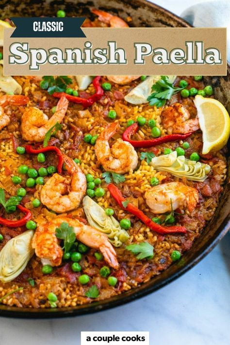 This Classic Spanish Paella Recipe made with saffron-scented rice, shrimp, and colorful vegetables. This stunning one-pan dinner is packed with authentic flavors! Find the recipe on our site. Best Paella Recipe, Spanish Paella Recipe, Vegetarian Paella, Rice Shrimp, Easy Paella, A Couple Cooks, Winter Salad Recipes, Spanish Paella, Paella Recipe