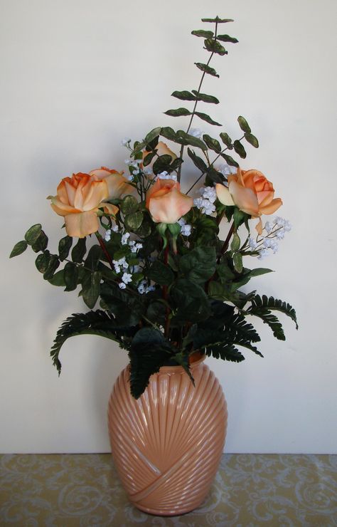 This stunning silk floral arrangement of 6 premium peach roses is surrounded by eucalyptus, fern, green leaves and baby's breath. The peach vase is reminiscent of the art deco style of the 1940s. Total dimensions for this silk flower arrangement are 28" high and 14" wide. 80s Flower Arrangements, 80s Floral Arrangements, Peach Vase, Anita Baker, Art Deco Room, Deco Room, 80s Decor, Lifestyle Shoot, 80s Floral