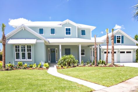 The Sanctuary - Beach Style - Exterior - Jacksonville - by Glenn Layton Homes | Houzz White House Blue Accents Exterior, Metal Roof Beach House, White Roof House Exterior Colors, Blue Stucco Exterior, White Beach House Exterior, Beach Houses Exterior, Coastal Cottage Exterior, Coastal House Exterior, Coastal Ideas