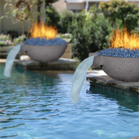 REAL CONCRETE FIRE And Water BOWLS Looking for a new centerpiece? Why not go with a fire and water bowl? ! Our 33 Inch Wok Fire and Water Bowl is great if you want something that’ll really make a great impression with your guests while you enjoy your outdoor space. This round modern fire and water bowl is ideal as a pool addition, but with the right setup it can be part of a beautiful and un... Pool Fire Bowls, Diy Fire Bowl, Garden Pool Party, Pool Upgrades, Pool Addition, Modern Pool And Spa, Pool Waterfalls, Pool Paradise, Pool Landscaping Ideas