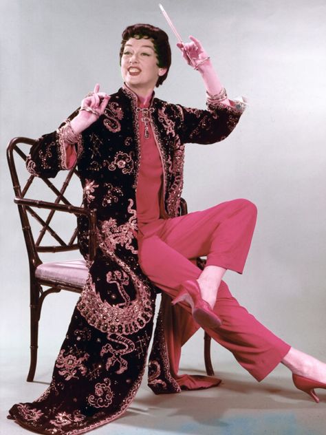 Rosalind Russell as Auntie Mame Brown And Orange Outfit, Orry Kelly, Auntie Mame, Rosalind Russell, Iconic People, Hollywood Costume, Orange Outfit, Brown And Orange, Movie Costumes