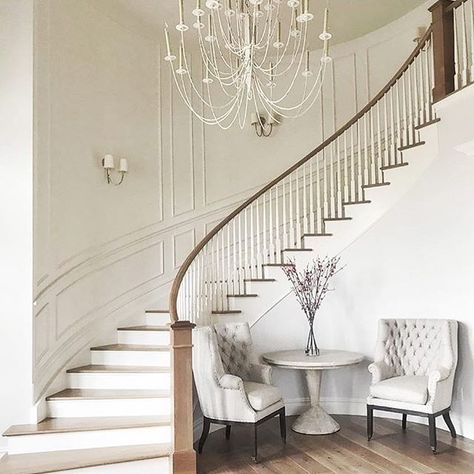 At our first meeting with our darling client we talked about her vision for a curved staircase in the entryway. And now here we are. Love how this turned out! #entrywaygoals Curved Staircase Foyer, Indoor Stair Railing, Wooden Staircase Design, درج السلم, Luxury Staircase, Foyer Staircase, House Staircase, Staircase Remodel, Wood Staircase