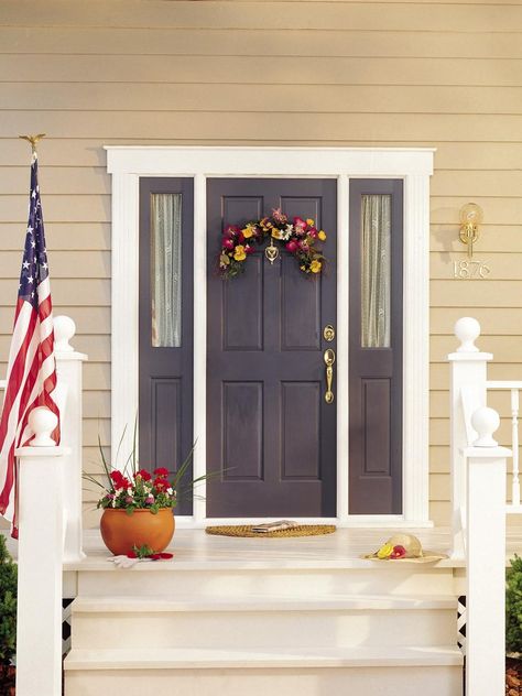 Check out DIYNetwork.com for paint colors and design ideas that will boost curb appeal and make your entry more inviting. Sw Regatta, Beige House Front Door Color, Popular Front Door Colors, Houses Entrance, Sw Naval, Yellow Siding, Entryway Diy, Purple Front Doors, Best Front Door Colors