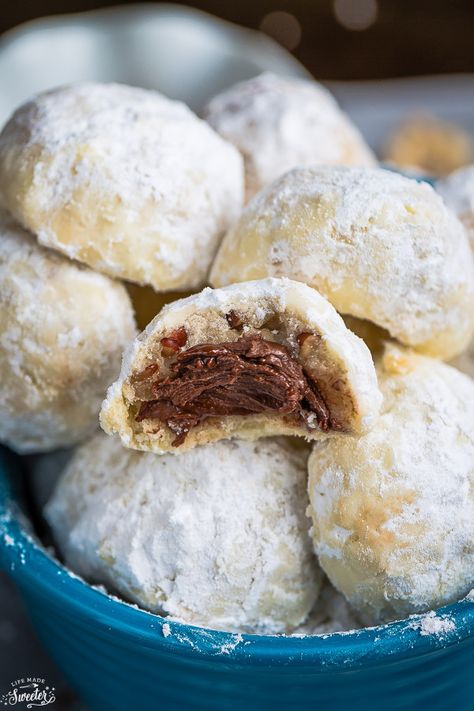 Nutella Stuffed Snowball Cookies are perfect for your Christmas cookie tray! Classic buttery shortbread-like cookies that are so easy to make with a surprise Nutella filling inside! Best Nutella Recipes, Cream Cheese Spritz Cookies, Pecan Snowball Cookies, Nutella Recipes Easy, Snowball Cookie Recipe, Cookie Exchange Recipes, Sugar Cookie Recipe Easy, Nutella Desserts, Chewy Peanut Butter Cookies