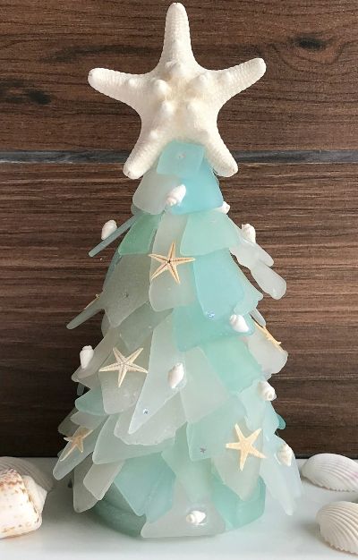 Seaglass Christmas with Trees, Ornaments, Garlands and more. Featured on Completely Coastal. Beach Christmas Decorations, Coastal Christmas Tree, Beach Glass Crafts, Coastal Christmas Decor, Beachy Christmas, Nautical Christmas, Cone Christmas Trees, Sea Glass Crafts, Beach Christmas