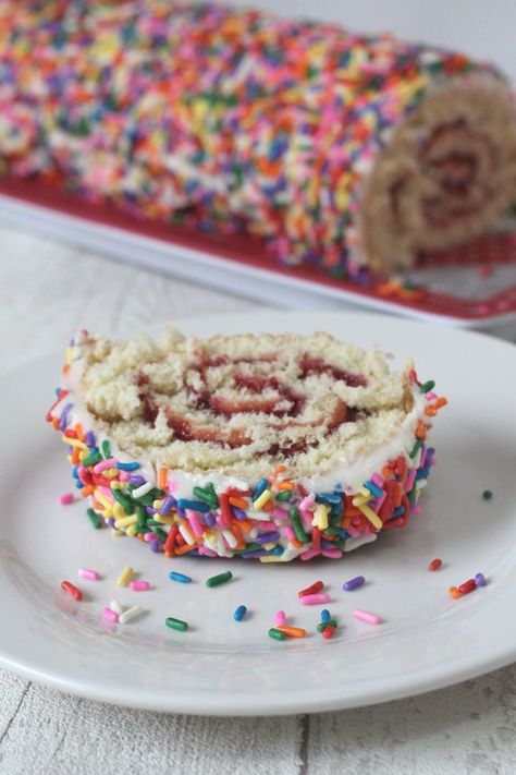 My Sprinkle Swiss Roll recipe makes a simple cake roll with raspberry jam, covered in a vanilla buttercream frosting and decorated with sprinkles! #swissroll #cake #decoratedswissroll Raspberry Delight, Easy Family Recipes, Vanilla Buttercream Frosting, Cake Mixture, Simple Cake, Fussy Eaters, Easy Meals For Kids, Swiss Roll, Caking It Up