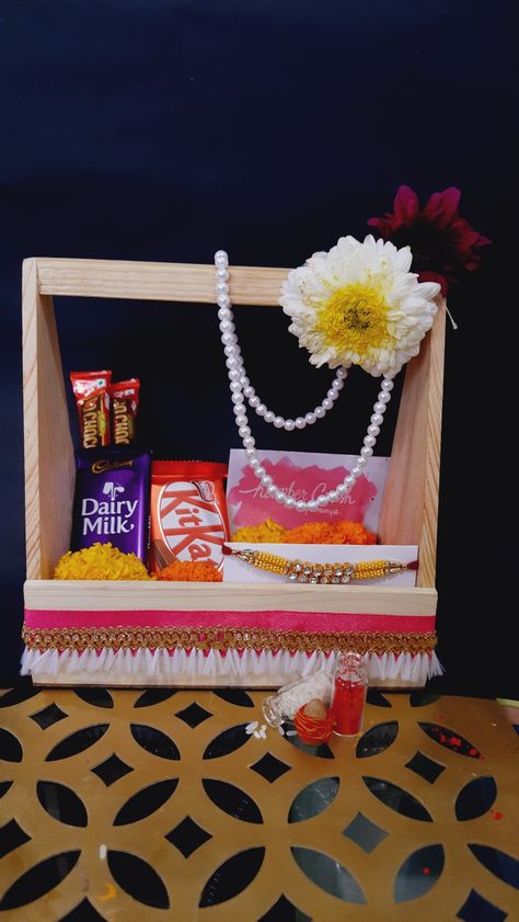 Here is q basic rakhi hamper Rakhi Box Design, Rakhi Hampers Diy, Rakhi Hampers For Brothers, Rakhi Packing Ideas, Rakhi Hamper Packing Ideas, Raksha Bandhan Gift Hampers, Rakhi Gift Hamper Ideas, Rakshabandhan Hampers, Rakhi Shoot