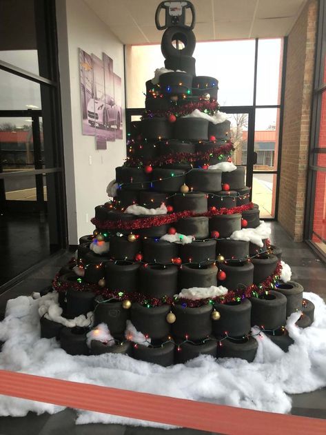 This Christmas Tree Made Out Of Tires At A Go-Kart Place Tire Christmas Tree, Mechanic Christmas Tree, Tire Holiday Decor, Drag Racing Christmas Tree, About Cars Christmas Tree, Racing Christmas Tree, Toy Car Christmas Tree Photo, Traditional Christmas Stockings, Christmas Tree Festival